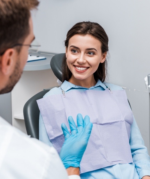 Smiling young woman talking to a sleep specialist in Frisco