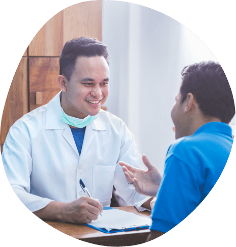 Man talking to medical professional in white lab coat