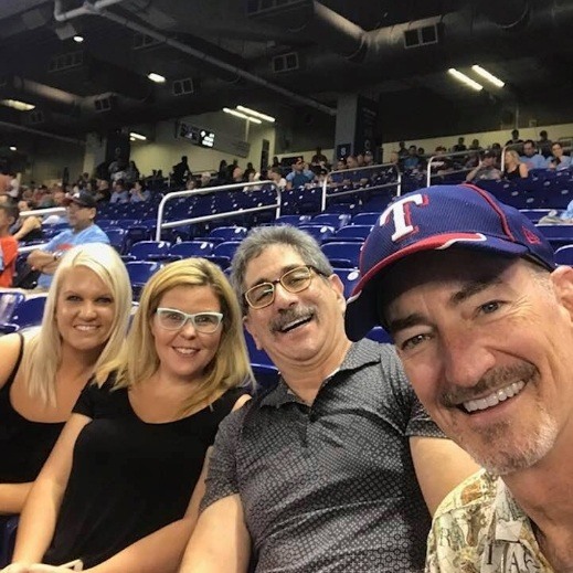 Doctor Smith with his family at a Texas Rangers game