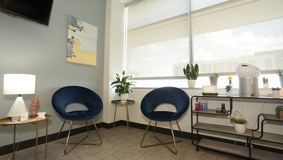 Two blue chairs in gray consultation room