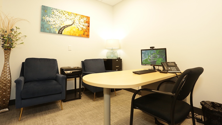 Small wooden desk with computer in consultation room at Star Sleep and Wellness in Frisco