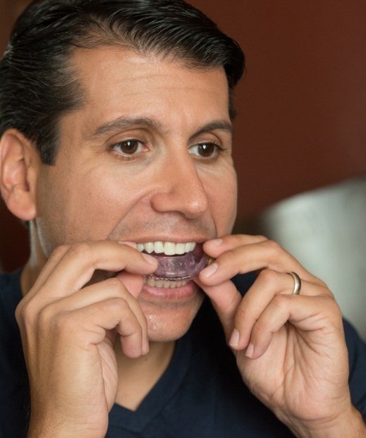 Man placing Frisco oral appliance in his mouth