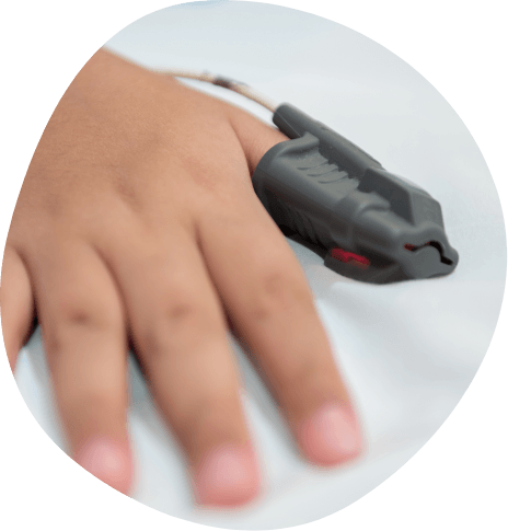 Close up of a hand with a finger probe over the index finger