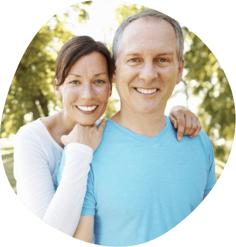 Man and woman smiling together outdoors
