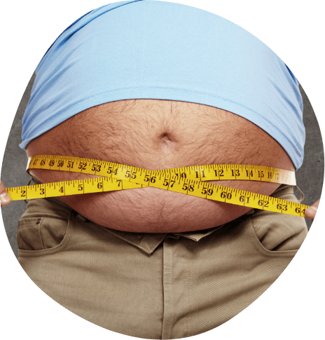 Man wrapping tape measurer around his stomach