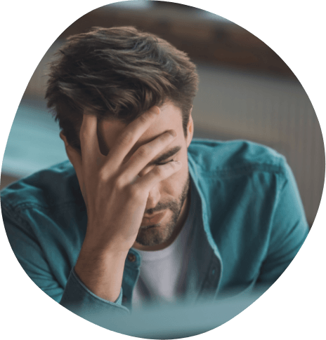 Man resting his head in his hand